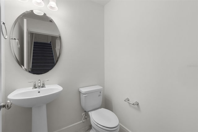 14538 Orchid Island Dr, Orlando, FL 32827 - half bathroom with baseboards and toilet
