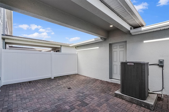 14538 Orchid Island Dr, Orlando, FL 32827 - view of patio / terrace featuring central AC unit