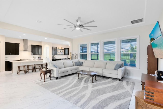 16696 Otterchase Ln, Winter Garden, FL 34787 - living room featuring plenty of natural light, ceiling fan, and light marble finish flooring