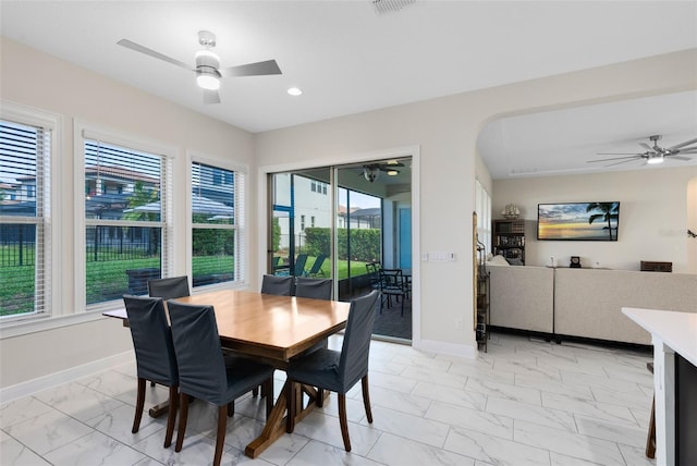 16696 Otterchase Ln, Winter Garden, FL 34787 - dining room with light marble finish flooring, ceiling fan, baseboards, recessed lighting, and arched walkways