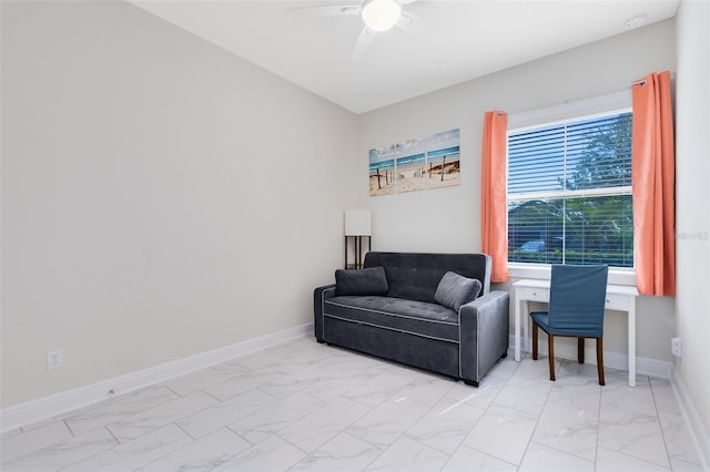 16696 Otterchase Ln, Winter Garden, FL 34787 - living area with light marble finish flooring, ceiling fan, and baseboards