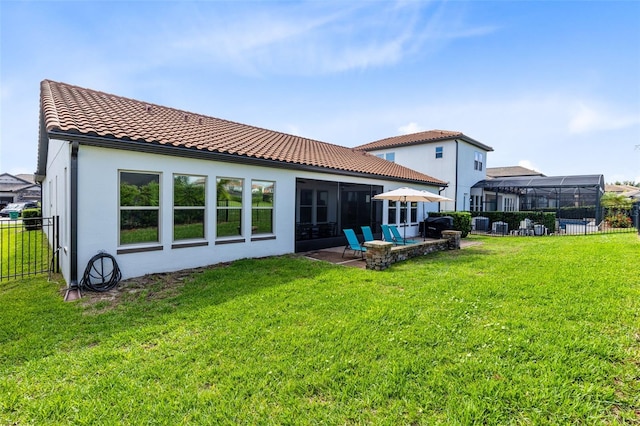 16696 Otterchase Ln, Winter Garden, FL 34787 - rear view of house featuring stucco siding, a tile roof, a patio, and a sunroom