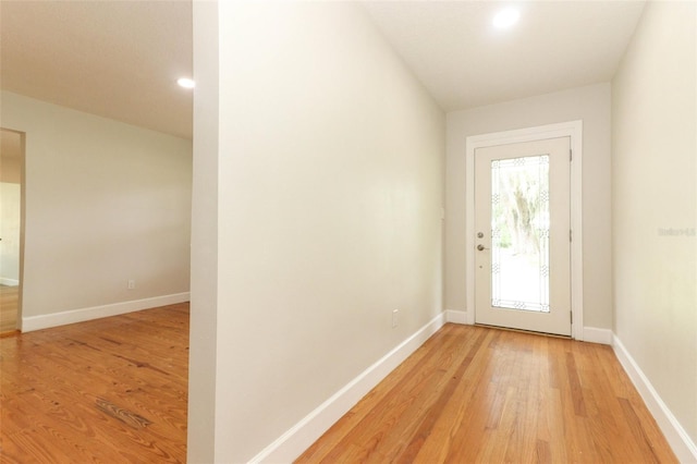 656 Lake Charm Dr, Oviedo, FL 32765 - doorway to outside with light wood-style floors, baseboards, and recessed lighting