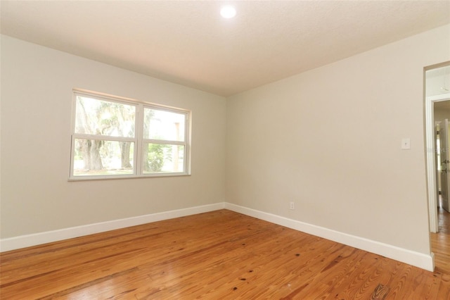 656 Lake Charm Dr, Oviedo, FL 32765 - unfurnished room featuring baseboards and light wood-style floors