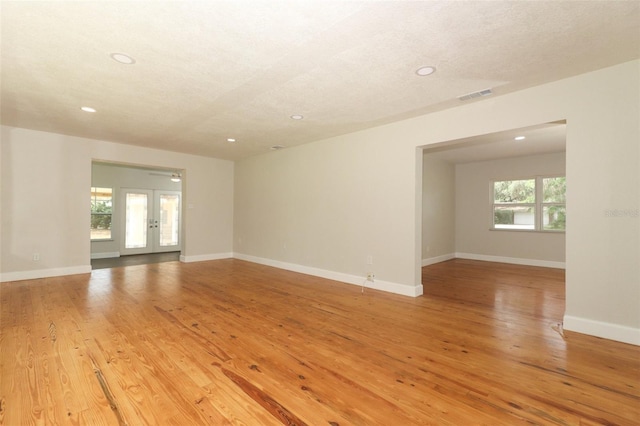 656 Lake Charm Dr, Oviedo, FL 32765 - spare room with recessed lighting, light wood-style floors, baseboards, and french doors