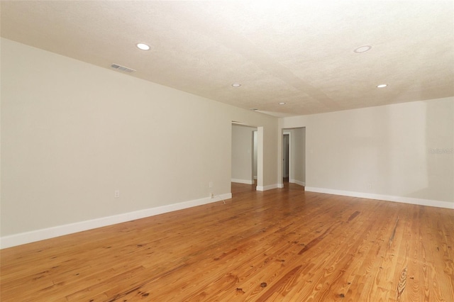 656 Lake Charm Dr, Oviedo, FL 32765 - empty room featuring recessed lighting, light wood-style floors, and baseboards