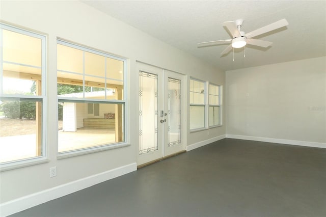 656 Lake Charm Dr, Oviedo, FL 32765 - spare room with healthy amount of natural light, finished concrete floors, a ceiling fan, and baseboards