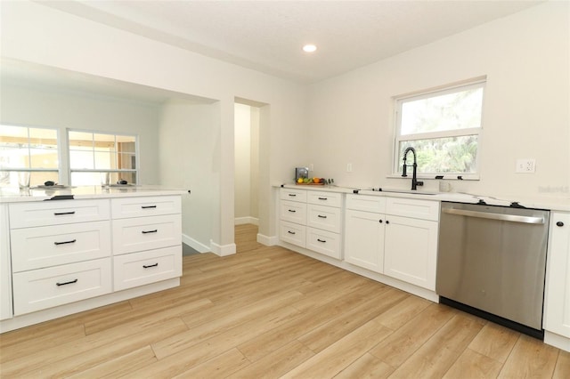 656 Lake Charm Dr, Oviedo, FL 32765 - kitchen with dishwasher, a sink, light wood-style floors, light countertops, and recessed lighting