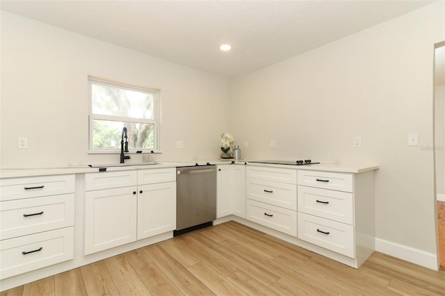656 Lake Charm Dr, Oviedo, FL 32765 - kitchen with dishwasher, a sink, light wood-style flooring, white cabinets, and recessed lighting