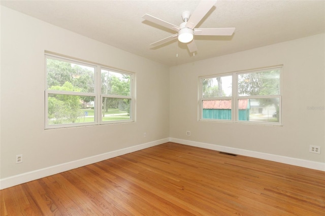 656 Lake Charm Dr, Oviedo, FL 32765 - empty room with baseboards, light wood-style flooring, and ceiling fan