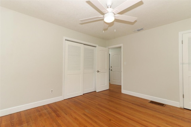 656 Lake Charm Dr, Oviedo, FL 32765 - unfurnished bedroom featuring baseboards, light wood-type flooring, a closet, and ceiling fan