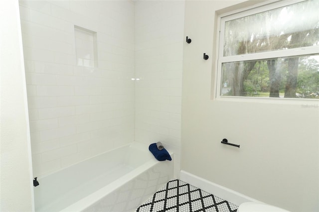 656 Lake Charm Dr, Oviedo, FL 32765 - full bathroom featuring baseboards and bathtub / shower combination