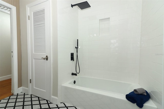 656 Lake Charm Dr, Oviedo, FL 32765 - full bathroom with baseboards and washtub / shower combination
