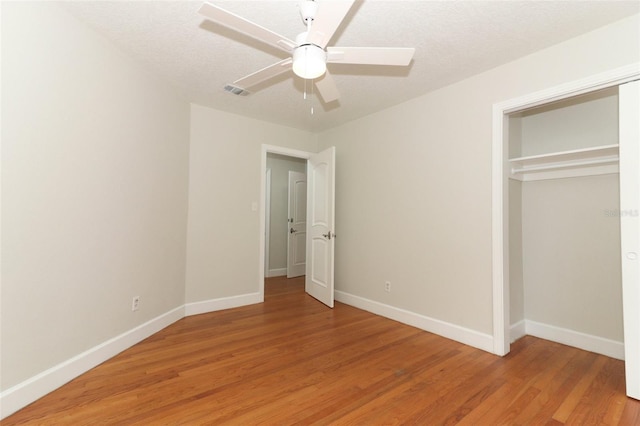 656 Lake Charm Dr, Oviedo, FL 32765 - unfurnished bedroom featuring baseboards, light wood-type flooring, a closet, and ceiling fan