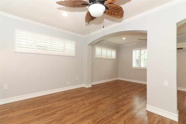656 Lake Charm Dr, Oviedo, FL 32765 - spare room with a ceiling fan, arched walkways, wood finished floors, baseboards, and ornamental molding