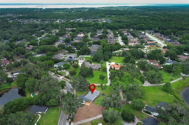 656 Lake Charm Dr, Oviedo, FL 32765 - aerial view of property's location with a large body of water, a heavily wooded area, and nearby suburban area
