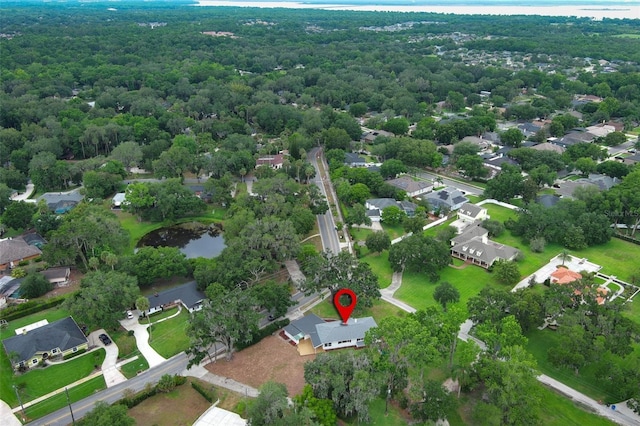 656 Lake Charm Dr, Oviedo, FL 32765 - aerial overview of property's location featuring a large body of water, a heavily wooded area, and nearby suburban area