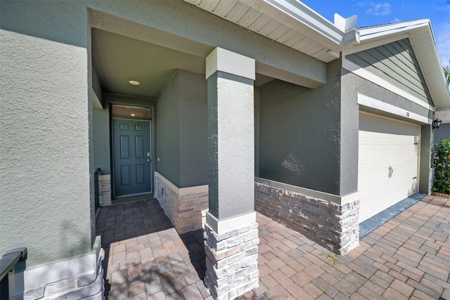 280 Caryota Ct, New Smyrna Beach, FL 32168 - entrance to property featuring stucco siding and a garage