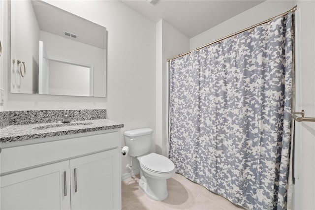 280 Caryota Ct, New Smyrna Beach, FL 32168 - full bathroom with toilet, tile patterned flooring, vanity, baseboards, and a shower with shower curtain