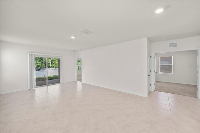 280 Caryota Ct, New Smyrna Beach, FL 32168 - empty room with recessed lighting, light tile patterned floors, and baseboards