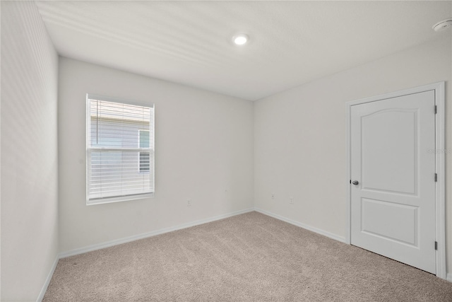 280 Caryota Ct, New Smyrna Beach, FL 32168 - carpeted empty room with baseboards and recessed lighting