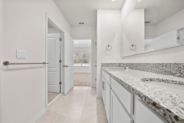 280 Caryota Ct, New Smyrna Beach, FL 32168 - full bath with tile patterned floors, baseboards, and double vanity