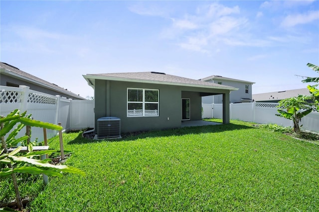 280 Caryota Ct, New Smyrna Beach, FL 32168 - rear view of house featuring central AC unit, stucco siding, and a patio