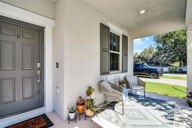 1123 Dora Parc Ln, Mount Dora, FL 32757 - property entrance featuring a porch and stucco siding