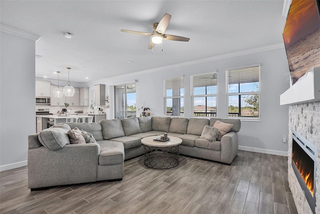 1123 Dora Parc Ln, Mount Dora, FL 32757 - living area with healthy amount of natural light, a ceiling fan, baseboards, crown molding, and wood finished floors