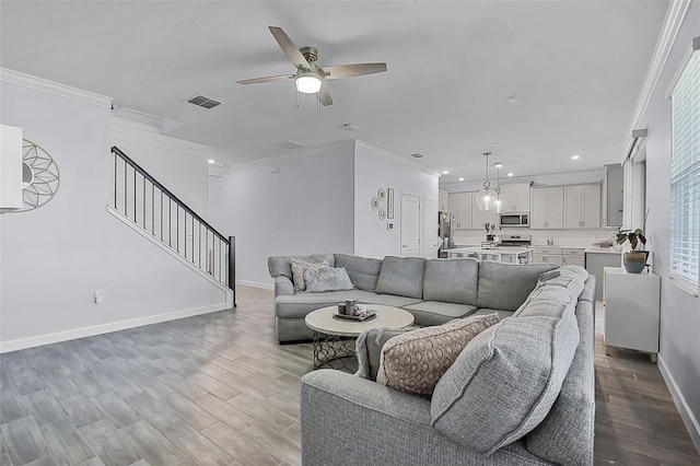 1123 Dora Parc Ln, Mount Dora, FL 32757 - living room featuring a ceiling fan, baseboards, recessed lighting, wood finished floors, and stairs