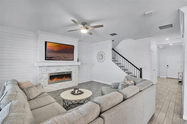 1123 Dora Parc Ln, Mount Dora, FL 32757 - living room featuring wood finished floors, ceiling fan, stairway, baseboards, and a fireplace