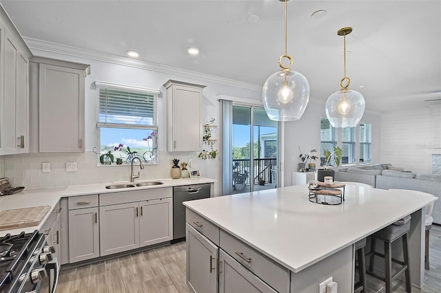 1123 Dora Parc Ln, Mount Dora, FL 32757 - kitchen with a sink, gray cabinets, stainless steel appliances, plenty of natural light, and ornamental molding