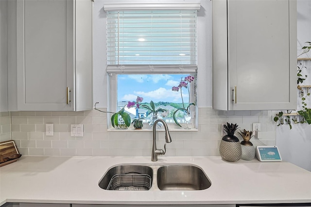 1123 Dora Parc Ln, Mount Dora, FL 32757 - kitchen with a sink, light countertops, and tasteful backsplash
