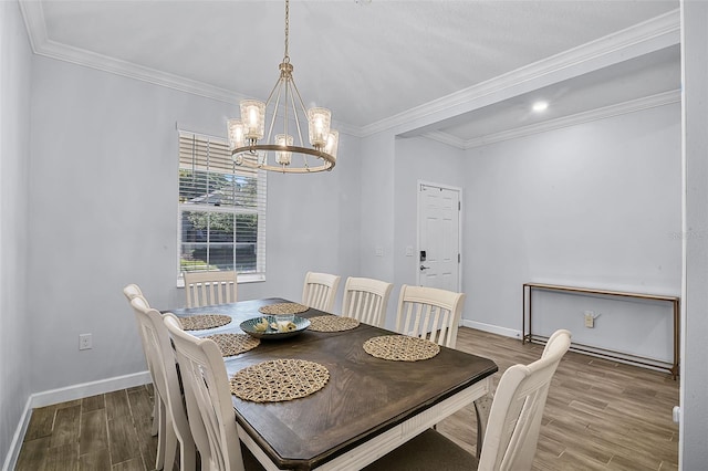 1123 Dora Parc Ln, Mount Dora, FL 32757 - dining room featuring wood finished floors, a chandelier, baseboards, and crown molding