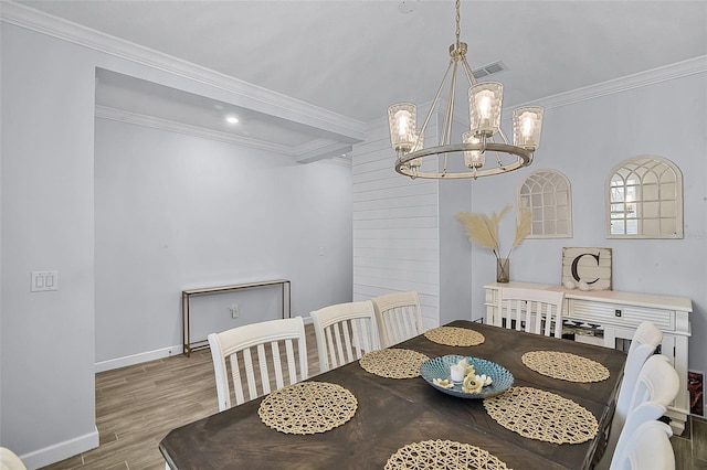 1123 Dora Parc Ln, Mount Dora, FL 32757 - dining room featuring a chandelier, ornamental molding, wood finished floors, and baseboards