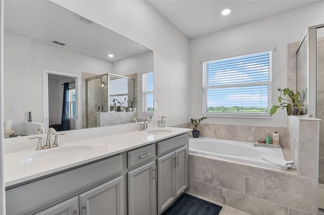 1123 Dora Parc Ln, Mount Dora, FL 32757 - full bath with a shower stall, double vanity, a garden tub, recessed lighting, and tile patterned flooring