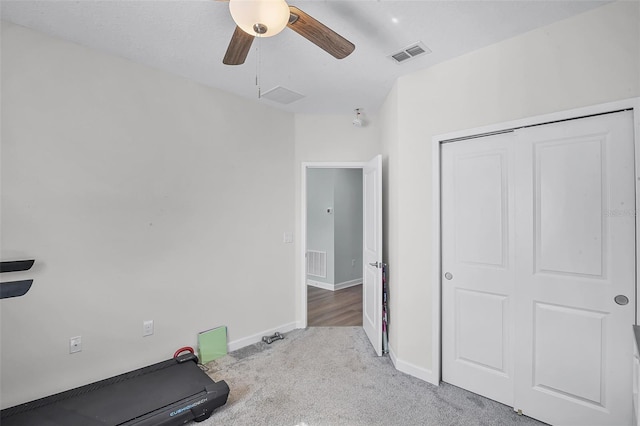 1123 Dora Parc Ln, Mount Dora, FL 32757 - workout room featuring light colored carpet, a ceiling fan, and baseboards