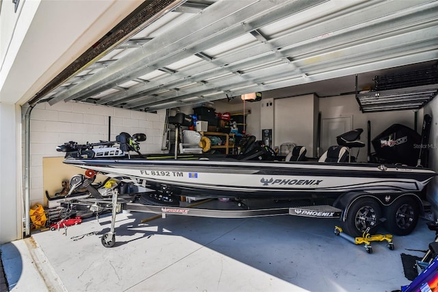 1123 Dora Parc Ln, Mount Dora, FL 32757 - garage with a garage door opener and concrete block wall