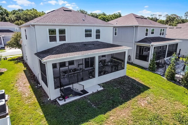1123 Dora Parc Ln, Mount Dora, FL 32757 - back of property with a sunroom, roof with shingles, a yard, and stucco siding