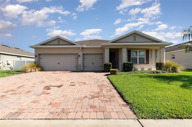 2249 Palmetum Loop, Apopka, FL 32712 - single story home featuring decorative driveway, stucco siding, a front yard, and a garage