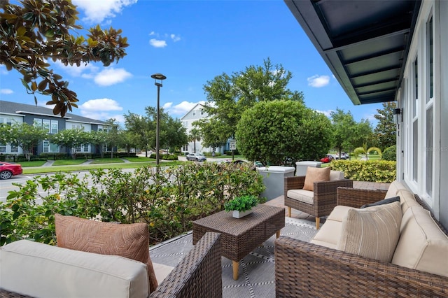 8692 Tavistock Lakes Blvd, Orlando, FL 32827 - balcony featuring an outdoor living space