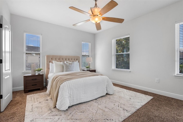 8692 Tavistock Lakes Blvd, Orlando, FL 32827 - carpeted bedroom with baseboards and ceiling fan