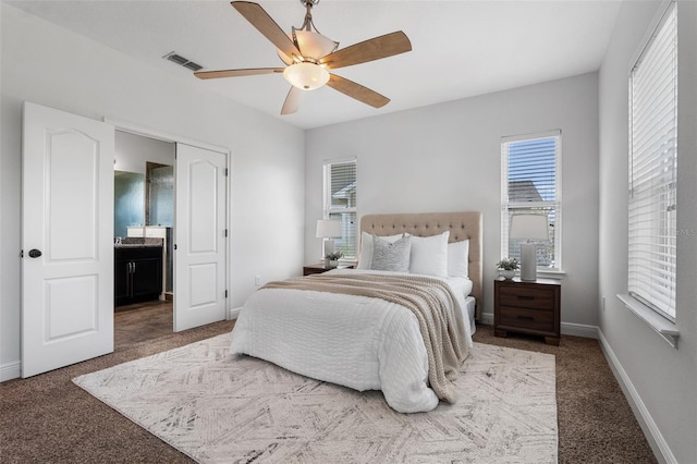 8692 Tavistock Lakes Blvd, Orlando, FL 32827 - carpeted bedroom with a ceiling fan and ensuite bathroom