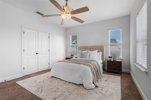 8692 Tavistock Lakes Blvd, Orlando, FL 32827 - carpeted bedroom with a ceiling fan and a closet