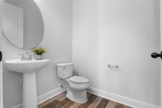 8692 Tavistock Lakes Blvd, Orlando, FL 32827 - bathroom with baseboards and wood finished floors