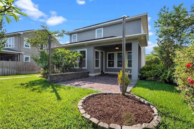 8692 Tavistock Lakes Blvd, Orlando, FL 32827 - back of property with a patio area and stucco siding