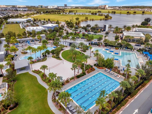 8692 Tavistock Lakes Blvd, Orlando, FL 32827 - bird's eye view of a pool and a nearby body of water