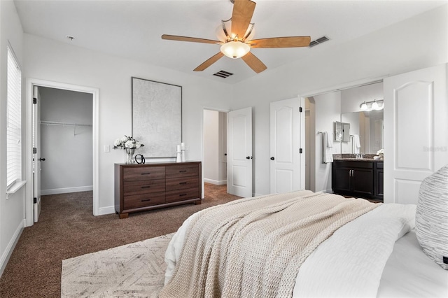 8692 Tavistock Lakes Blvd, Orlando, FL 32827 - bedroom with carpet floors, a closet, a spacious closet, ensuite bathroom, and ceiling fan