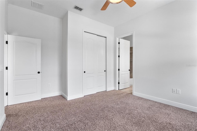 8692 Tavistock Lakes Blvd, Orlando, FL 32827 - unfurnished bedroom featuring light colored carpet, a closet, and a ceiling fan