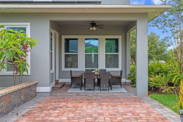 8692 Tavistock Lakes Blvd, Orlando, FL 32827 - view of patio / terrace with a ceiling fan and outdoor dining space